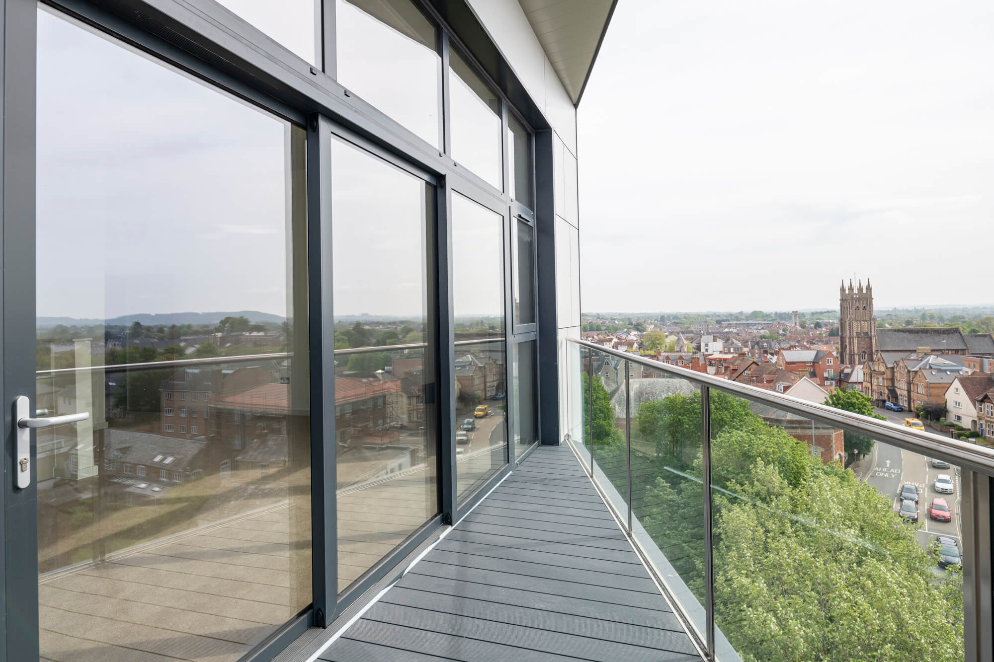 View over the city from a balcony with glass barrier