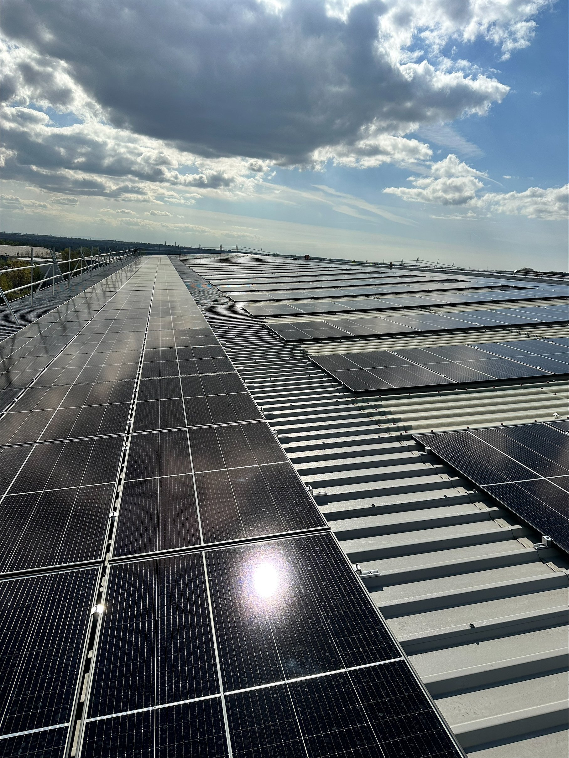 Solar panels on top of a building on a sunny day