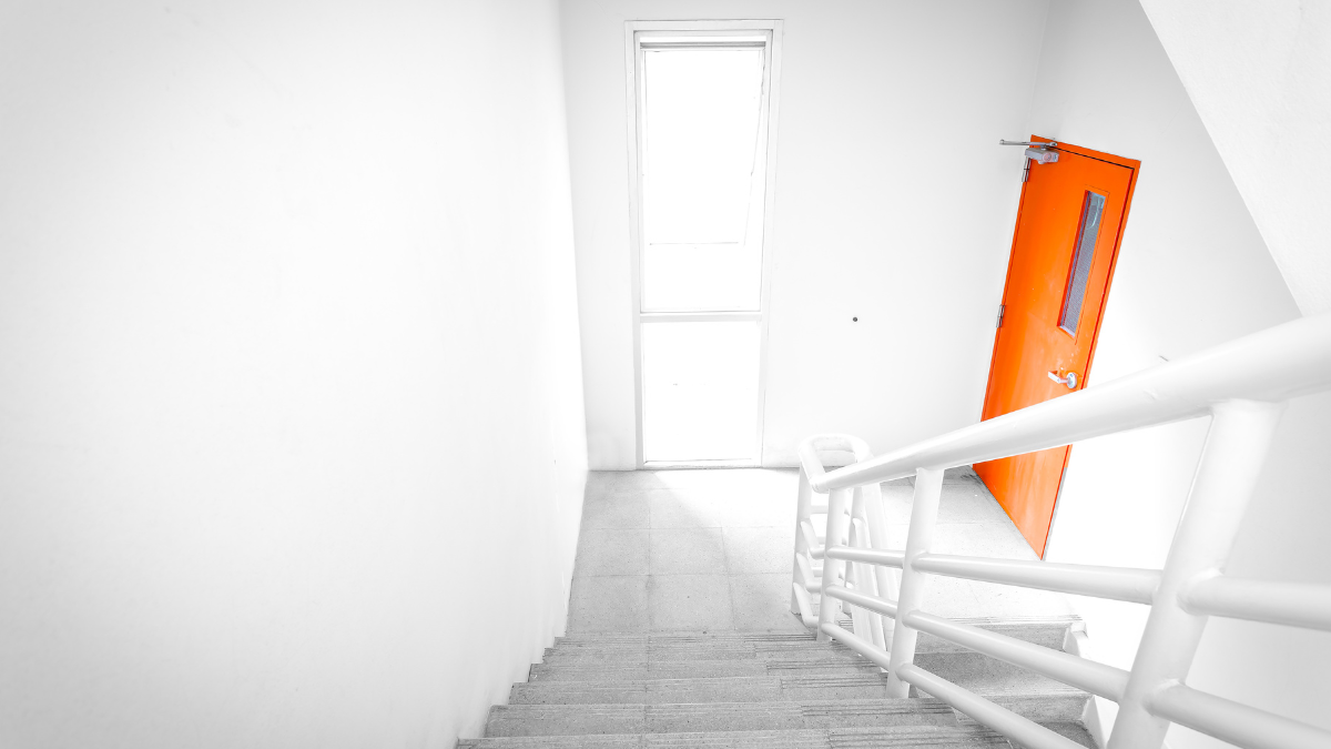 Stairwell with orange door